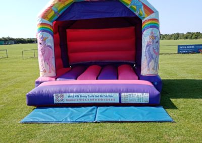 Unicorn design bouncy castle for the perfect childrens party
